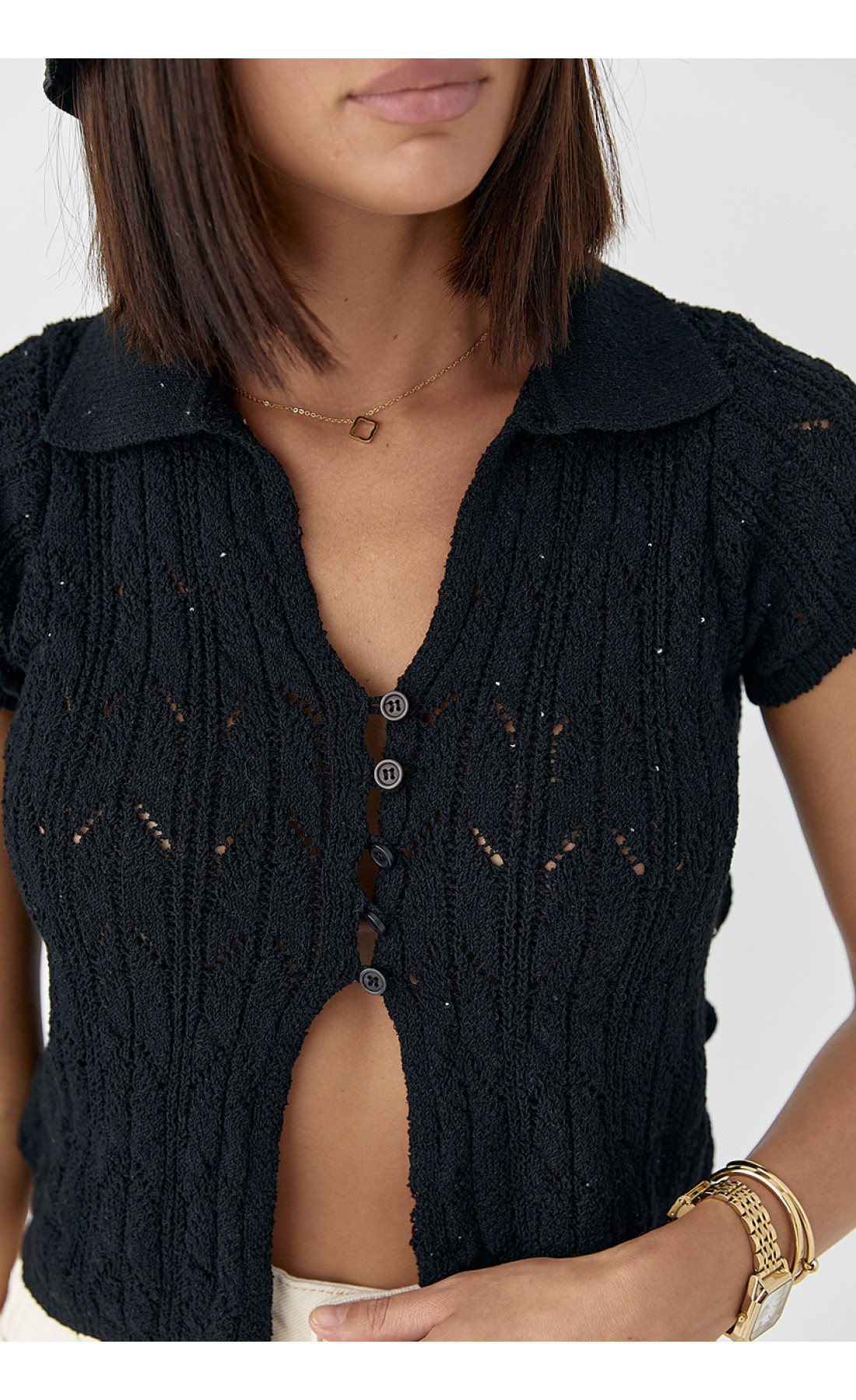 Жіноче поло на ґудзиках з ажурної в'язки  чорний колір