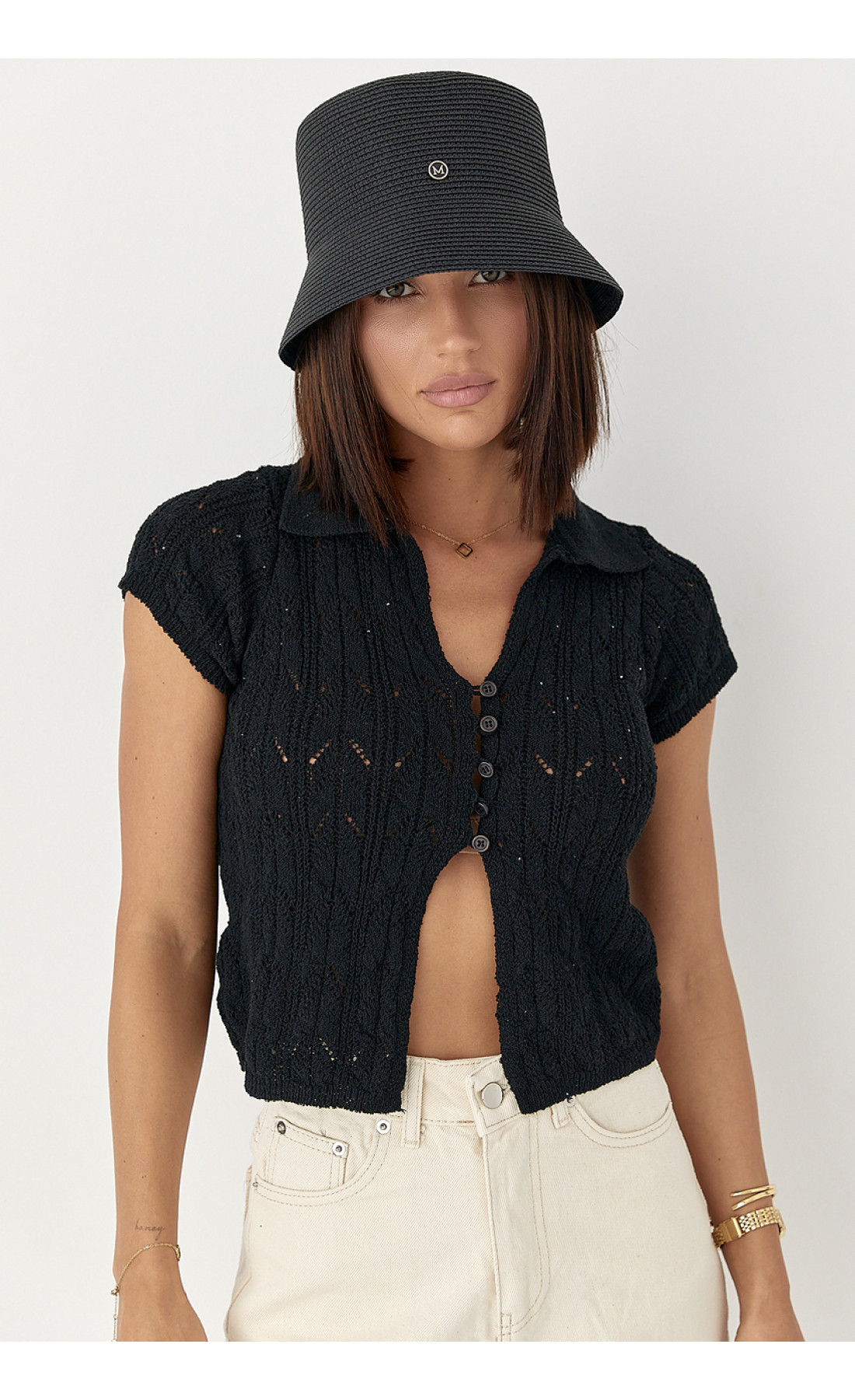 Жіноче поло на ґудзиках з ажурної в'язки  чорний колір