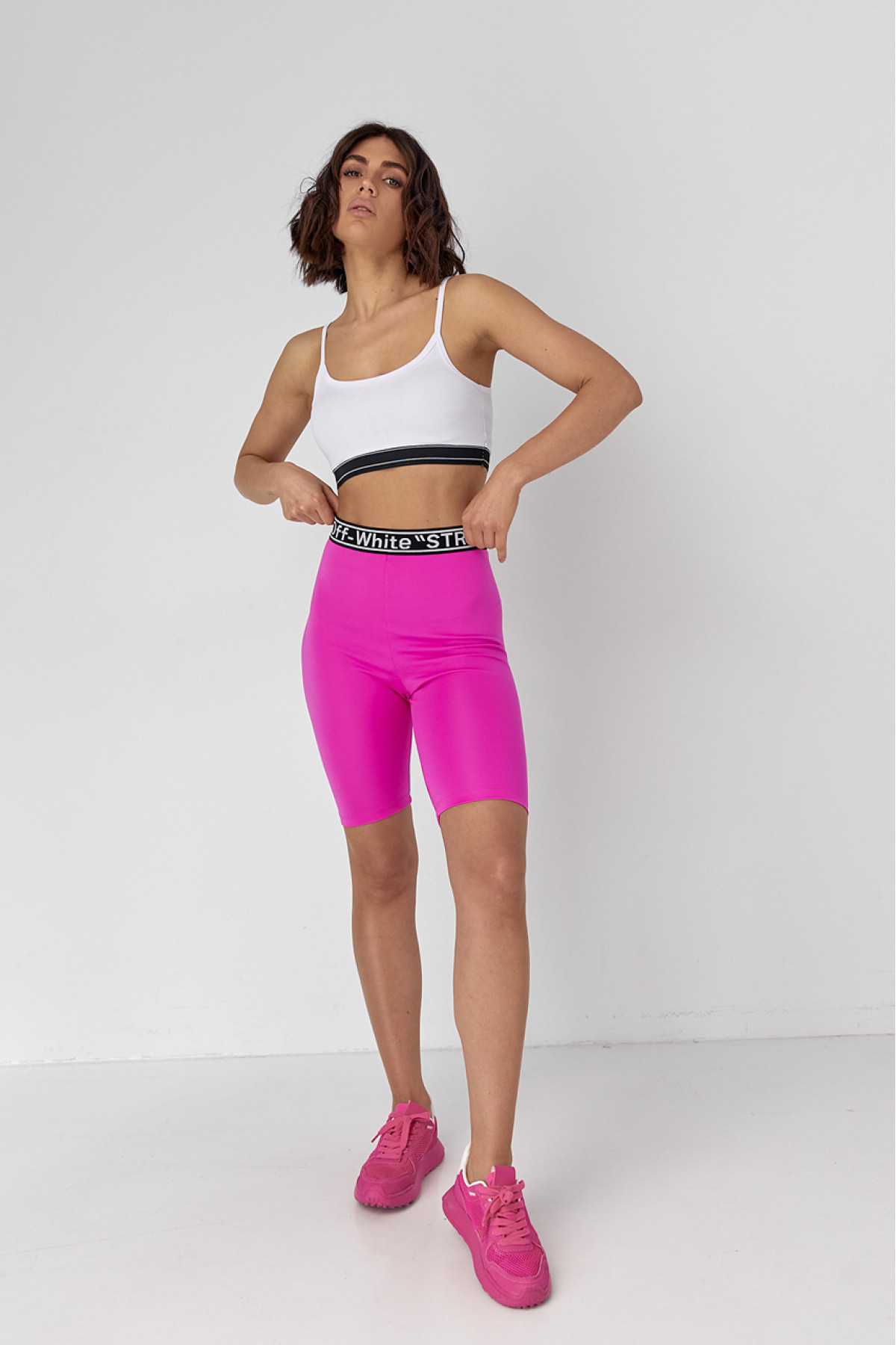 Жіночий костюм з велосипедними шортами та топом  фуксія колір