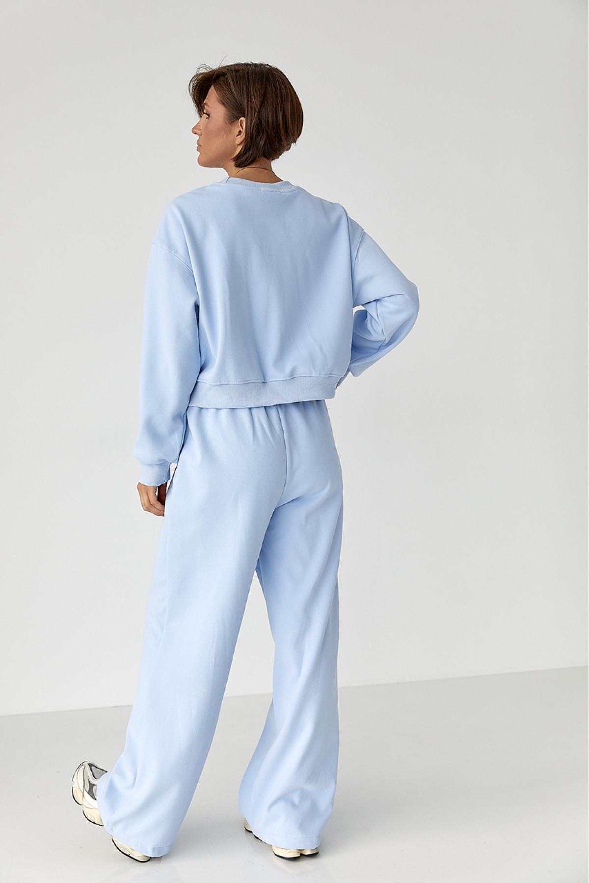 Спортивний костюм із плюшевим начосом з коротким світшотом та штанами палаццо  блакитний колір