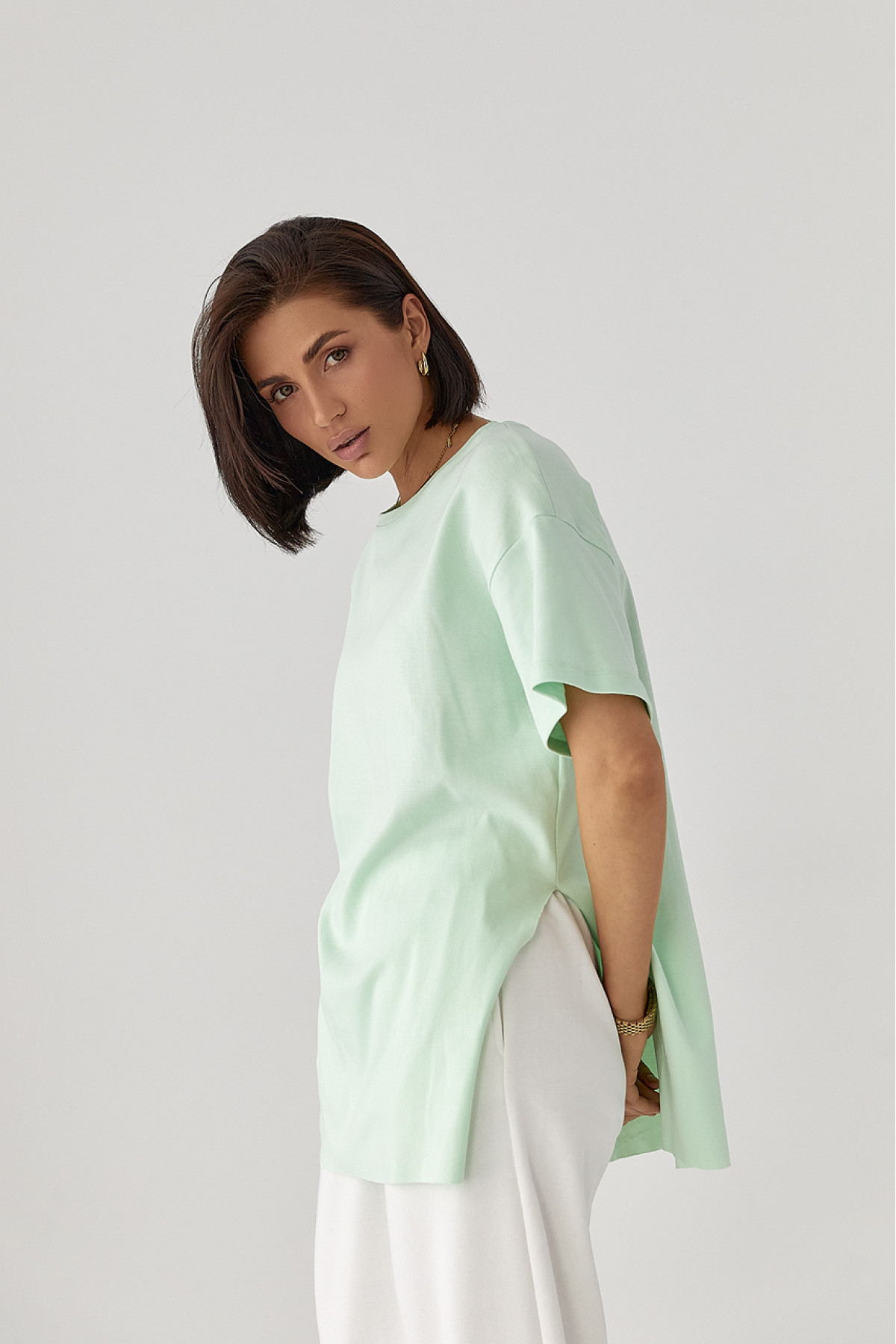 Однотонна футболка з розрізами  м'ятний колір