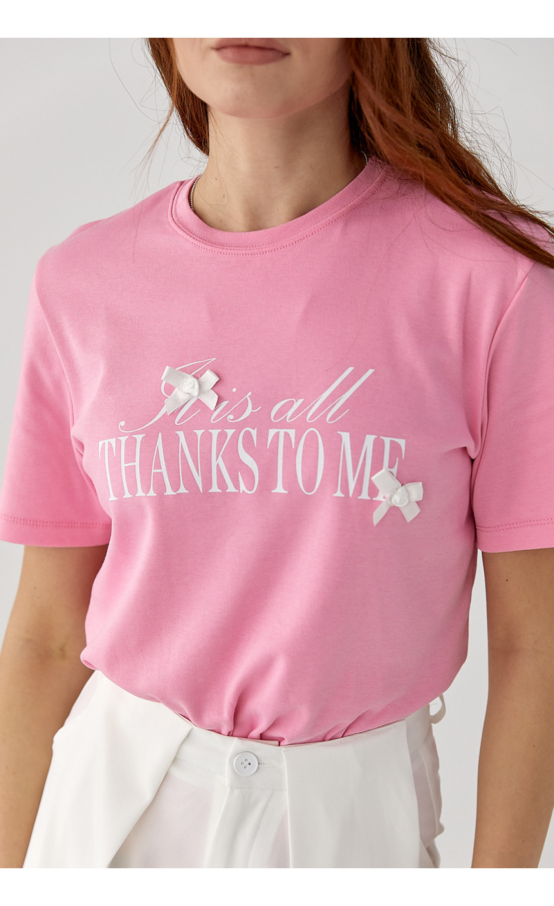 Футболка з написом і бантами  рожевий колір