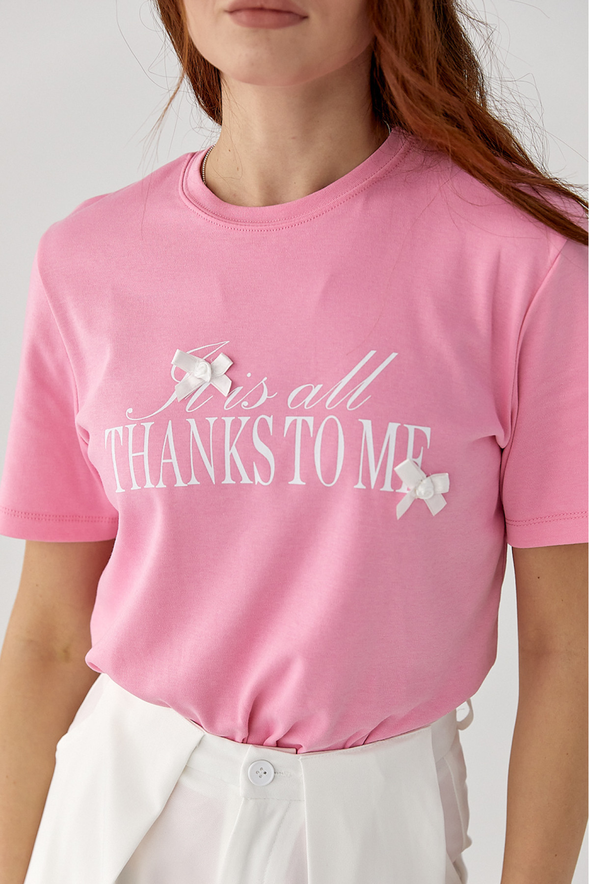 Футболка з написом і бантами  рожевий колір