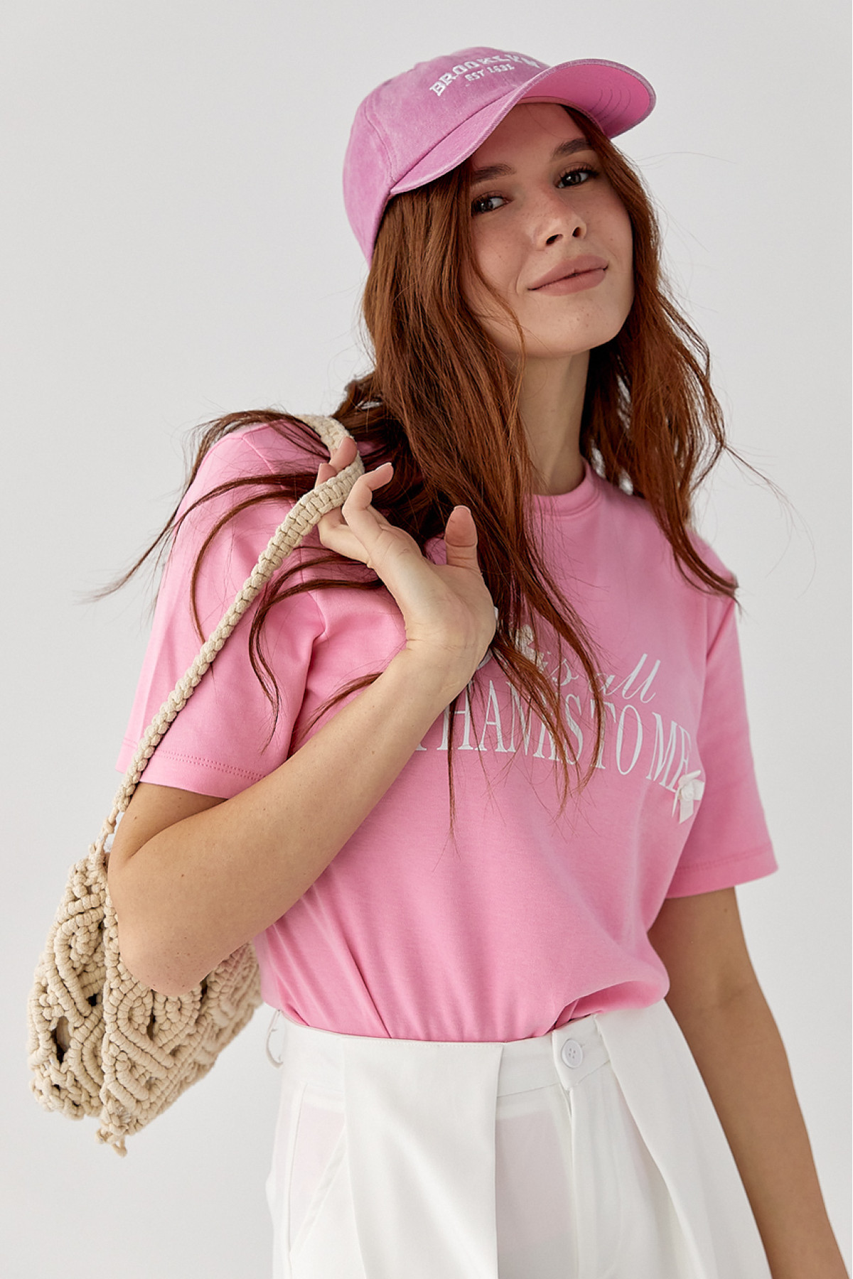 Футболка з написом і бантами  рожевий колір