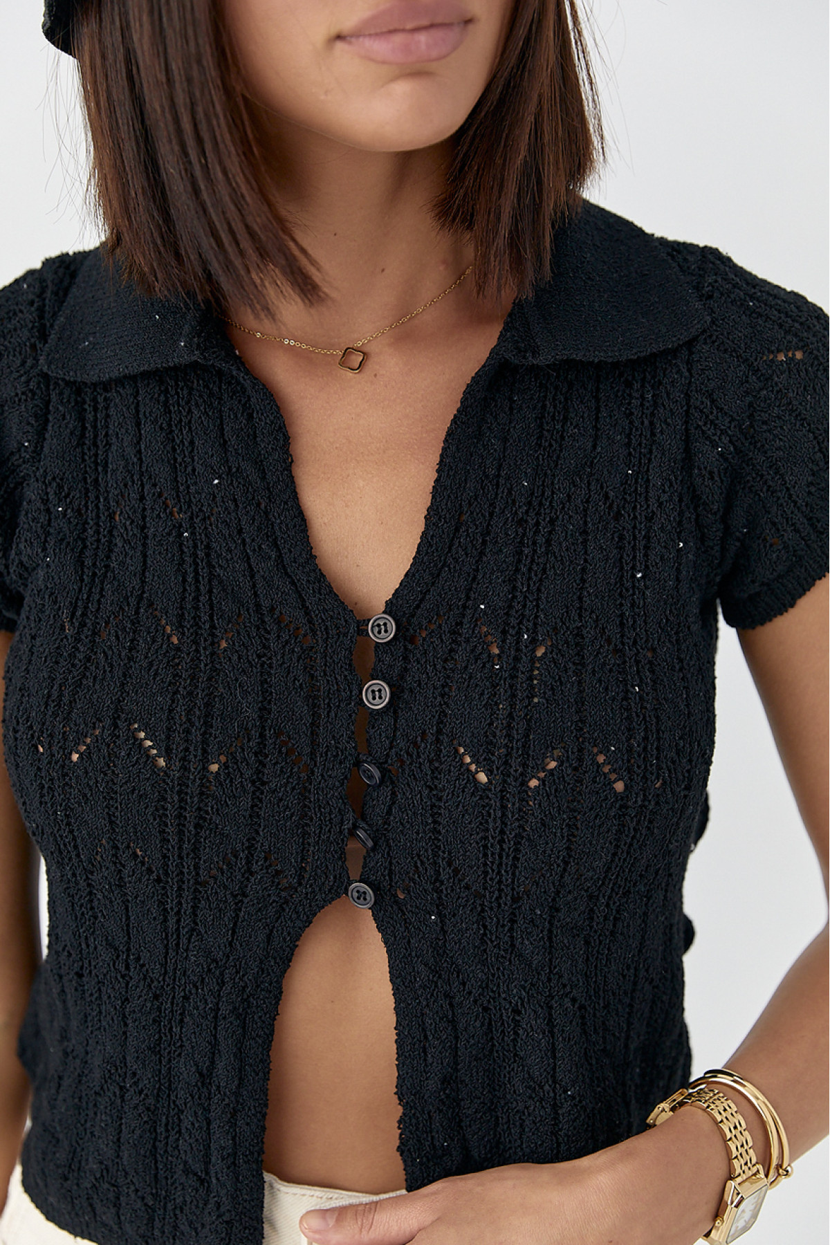 Жіноче поло на ґудзиках з ажурної в'язки  чорний колір