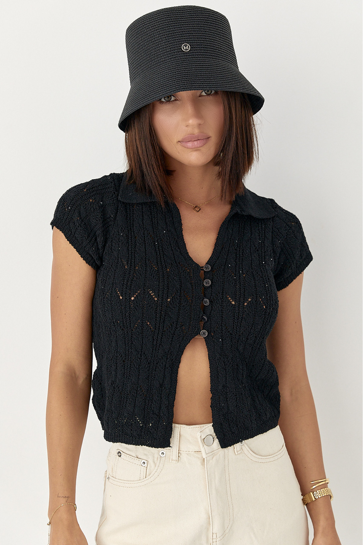 Жіноче поло на ґудзиках з ажурної в'язки  чорний колір