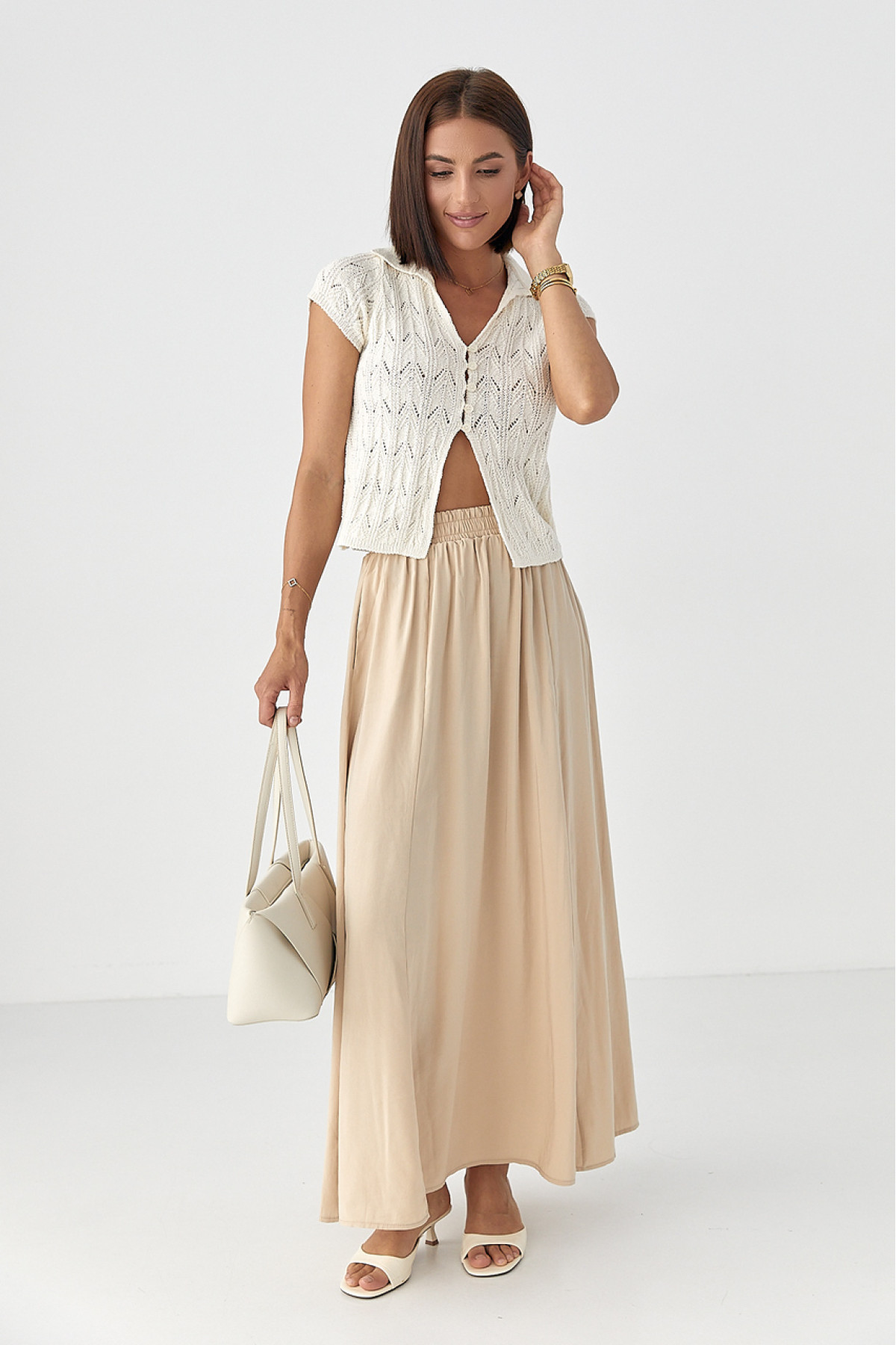 Жіноче поло на ґудзиках з ажурної в'язки  молочний колір