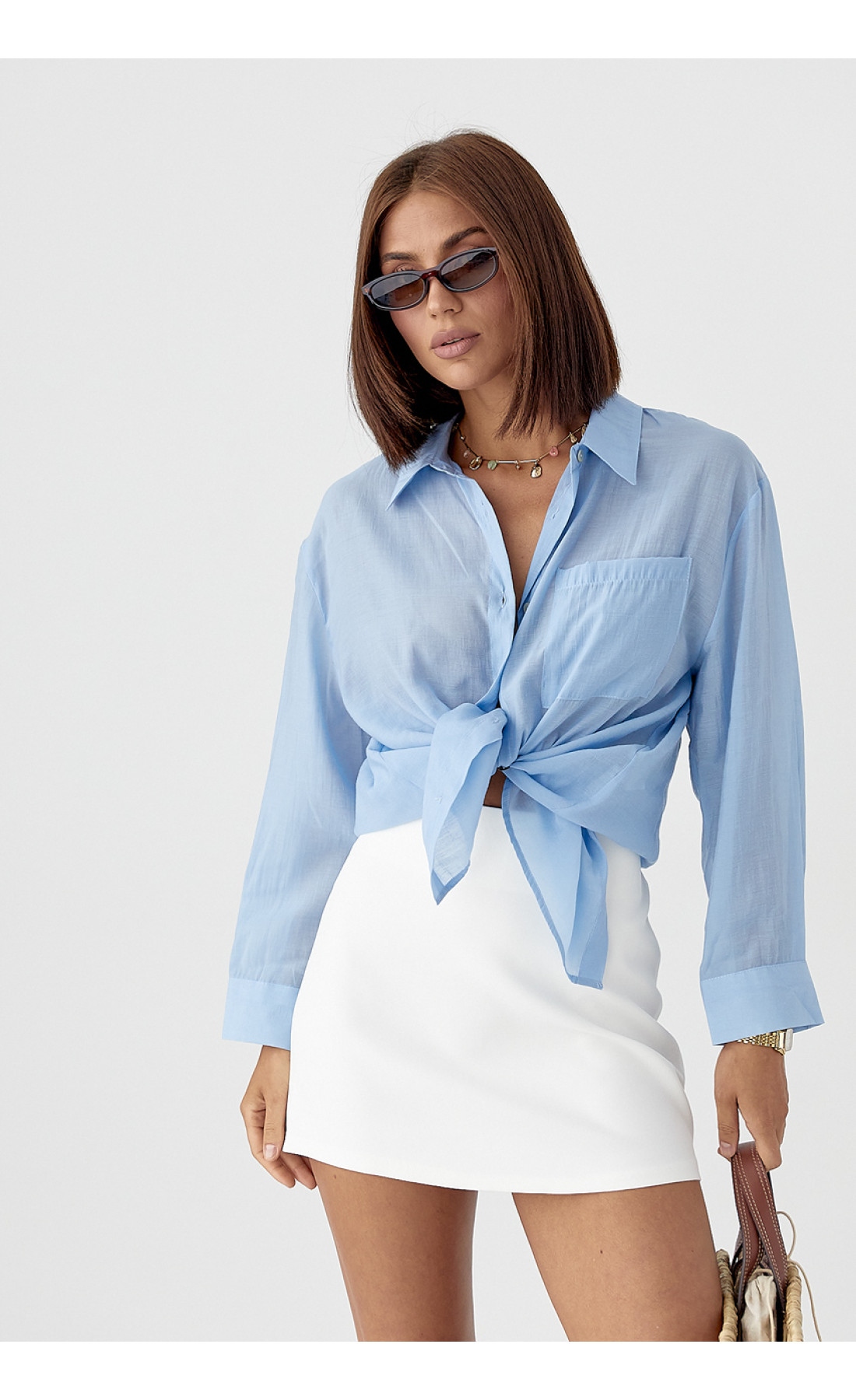 Прозора сорочка з декоративними ґудзиками на спині  блакитний колір