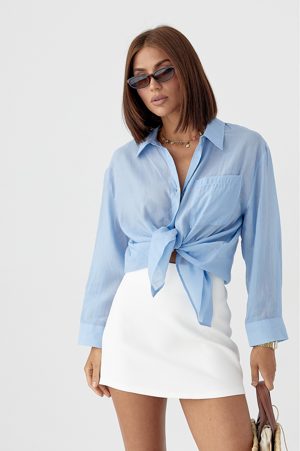 Прозора сорочка з декоративними ґудзиками на спині  блакитний колір