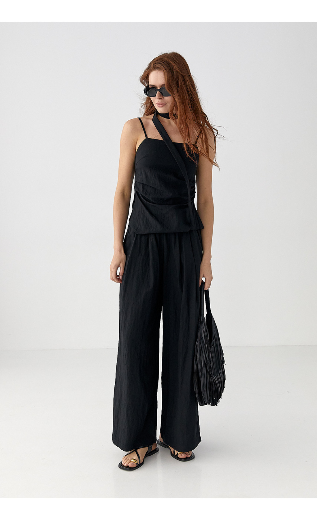 Костюм з асиметричним топом і штанамипалаццо  чорний колір