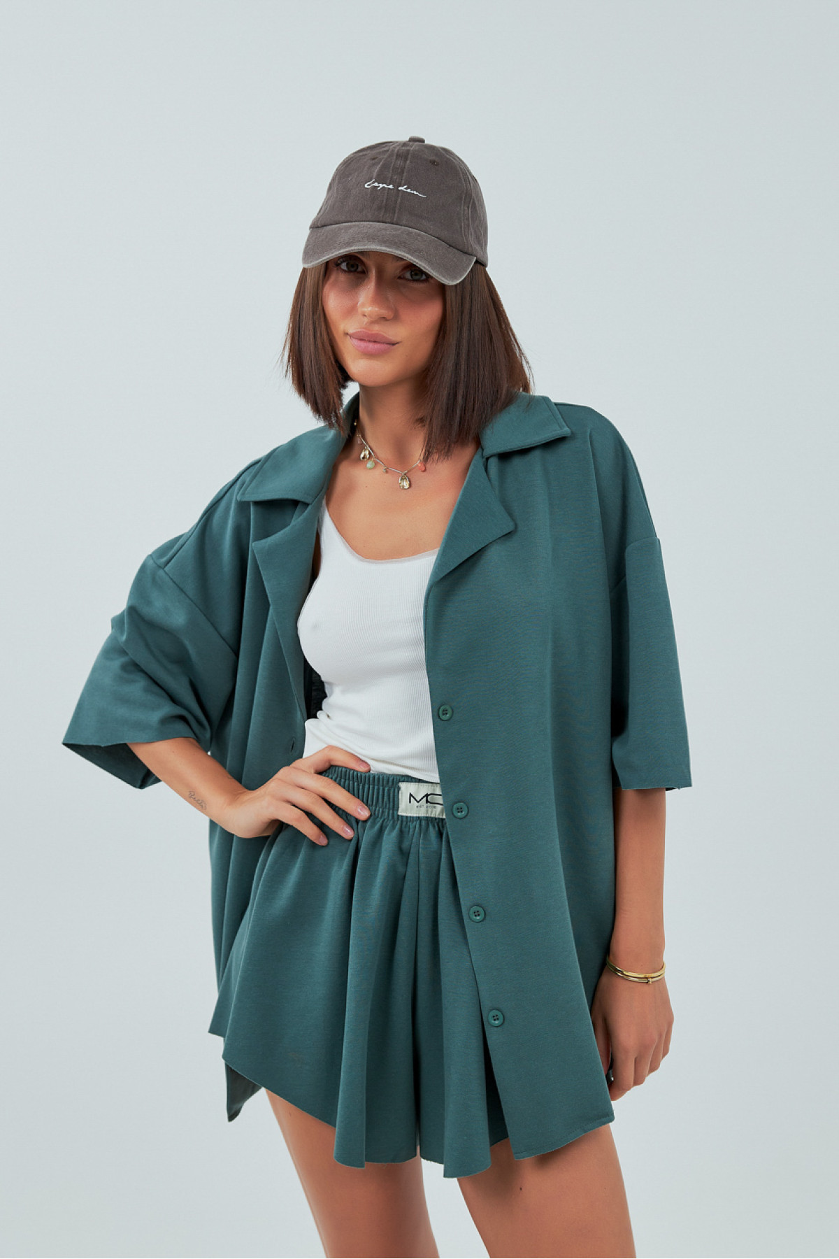 Трикотажний костюм із шортами та сорочкою  зелений колір