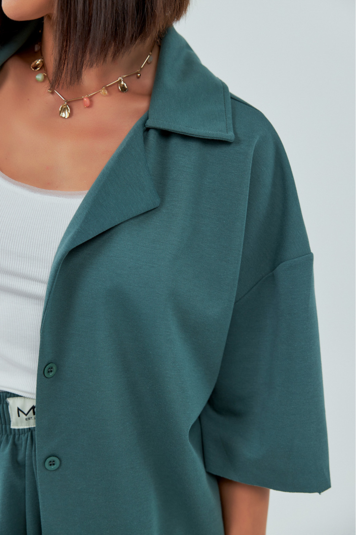 Трикотажний костюм із шортами та сорочкою  зелений колір