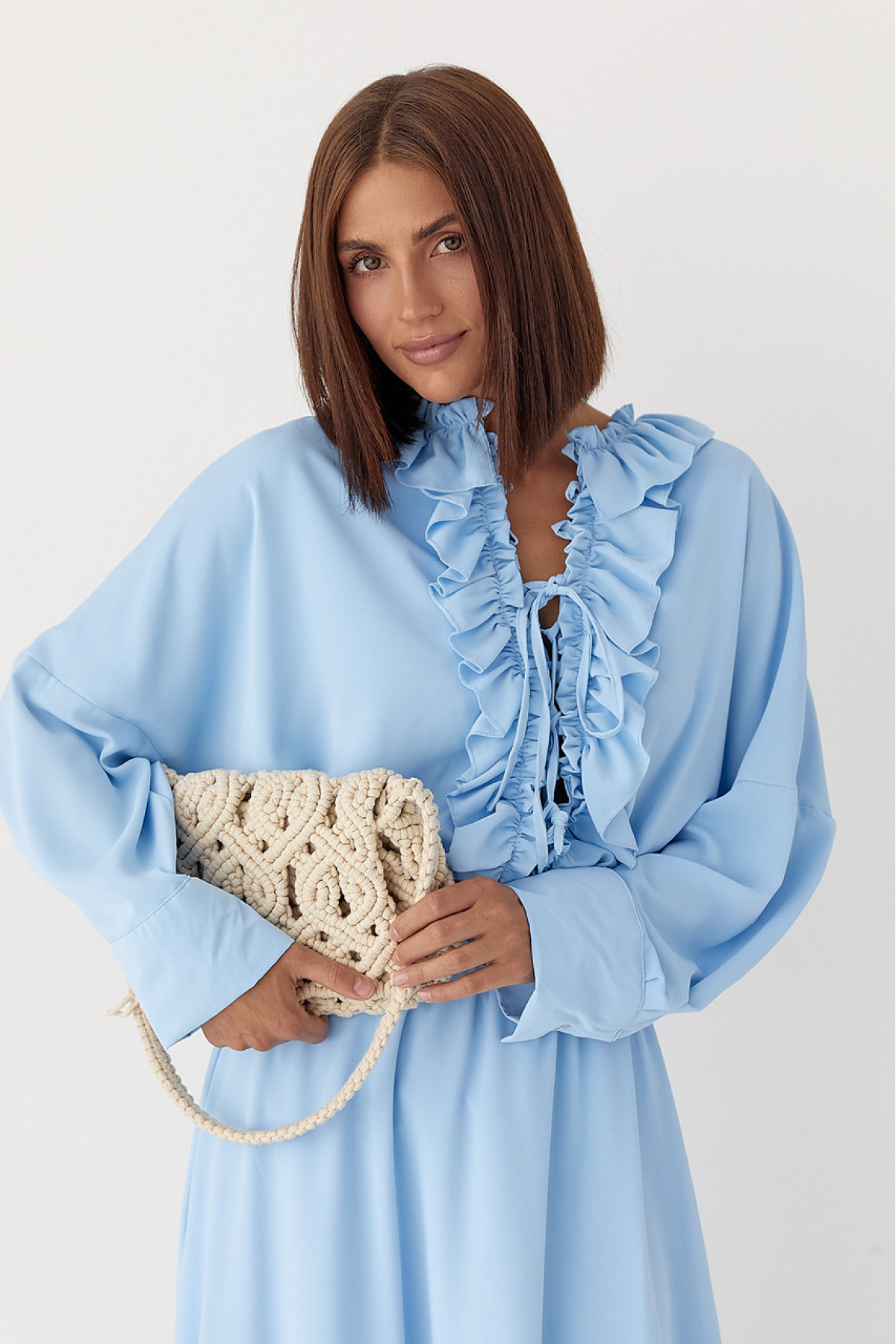 Костюм з рюшами зі спідниці та блузи  блакитний колір