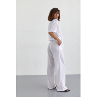 Жіночий літній костюм із брюками та блузкою на зав'язках  білий колір