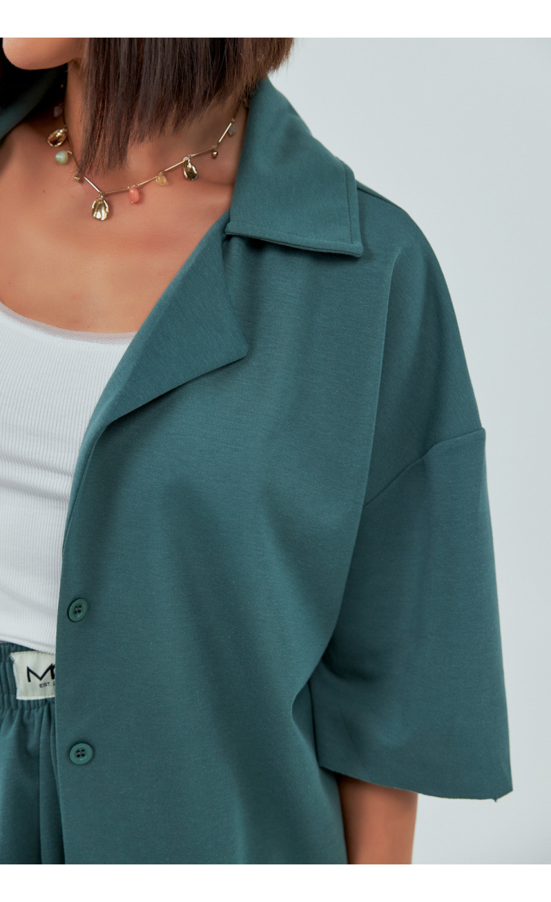 Трикотажний костюм із шортами та сорочкою  зелений колір