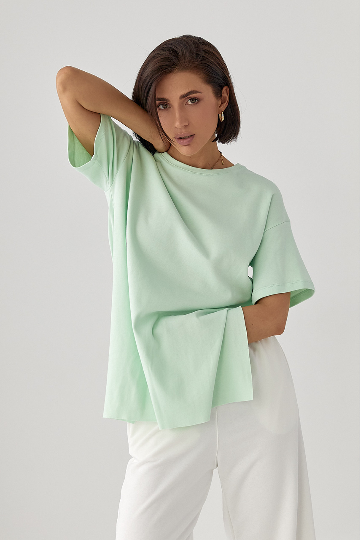 Однотонна футболка з розрізами  м'ятний колір