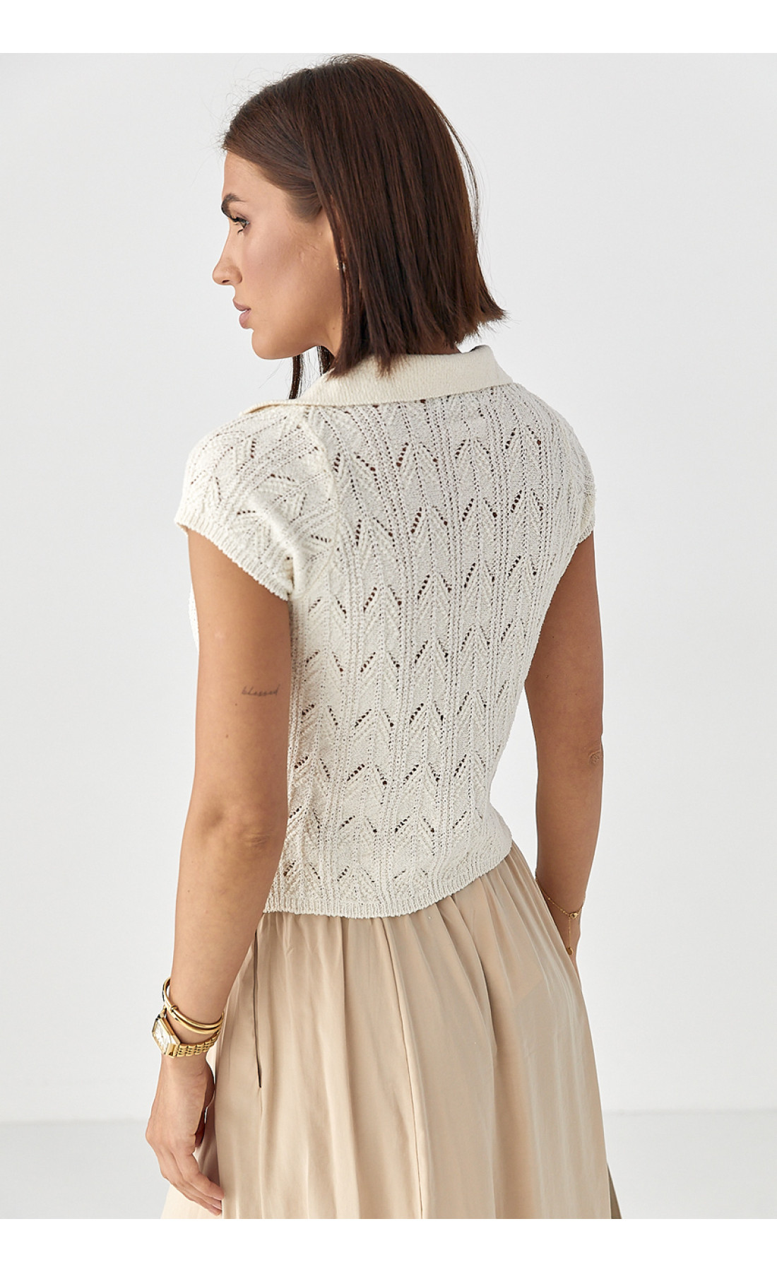 Жіноче поло на ґудзиках з ажурної в'язки  молочний колір