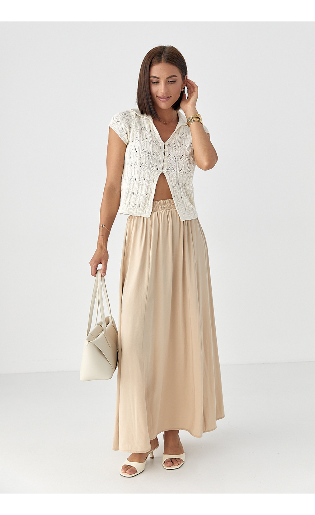 Жіноче поло на ґудзиках з ажурної в'язки  молочний колір