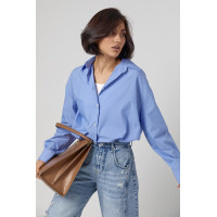 Класична однотонна жіноча сорочка з напівкруглим низом  блакитний колір
